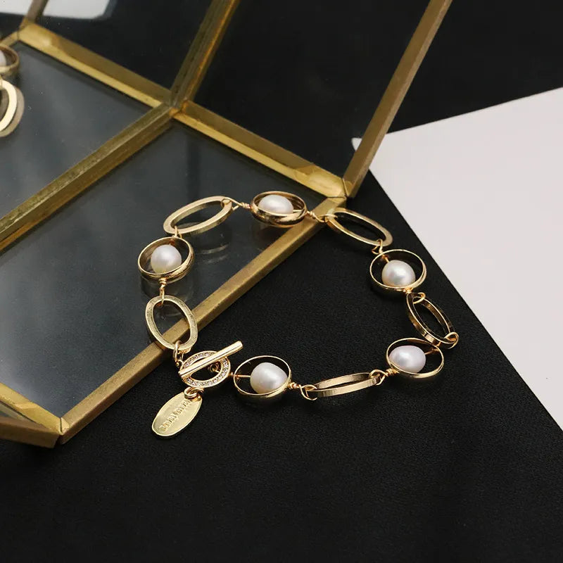 Pulsera de acero con perla de agua dulce